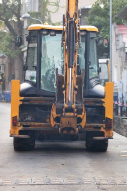 Construction workers at construction site and heavy duty bulldozer in Bucharest, Romania, 2023