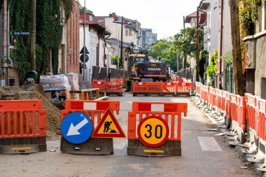 Construction workers at construction site and heavy duty bulldozer in Bucharest, Romania, 2023