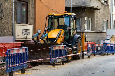 Construction workers at construction site and heavy duty bulldozer in Bucharest, Romania, 2023