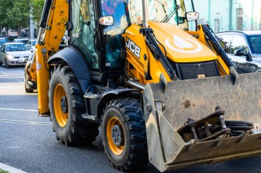 Construction workers at construction site and heavy duty bulldozer in Bucharest, Romania, 2023