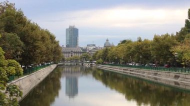 View of Dambovita river and skyscraper tower at Izvor area, near the Parliament building