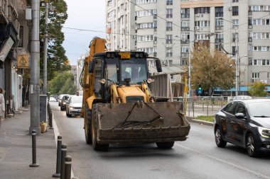 Construction workers at construction site and heavy duty bulldozer in Bucharest, Romania, 2023