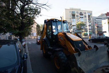 Construction workers at construction site and heavy duty bulldozer in Bucharest, Romania, 2023