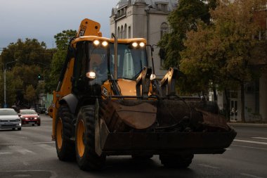 Construction workers at construction site and heavy duty bulldozer in Bucharest, Romania, 2023