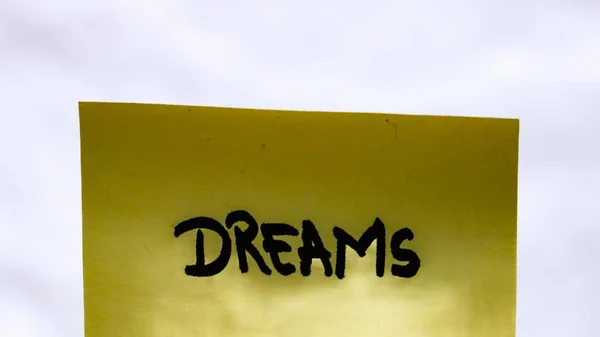 Dreams Handwriting Text Close Isolated Yellow Paper Copy Space — Stock Photo, Image