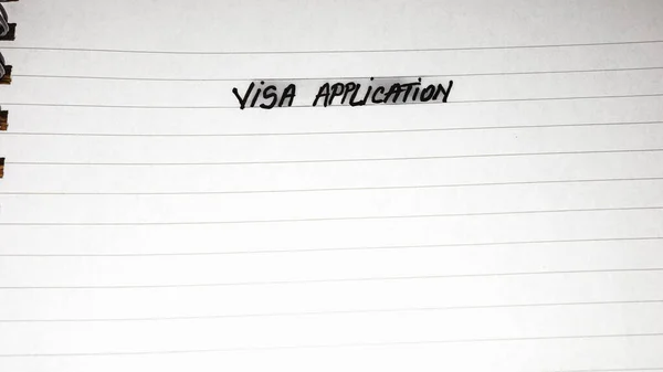 签证申请 笔迹文字在办公室议程页 办公室螺旋式笔记本 复制空间 — 图库照片