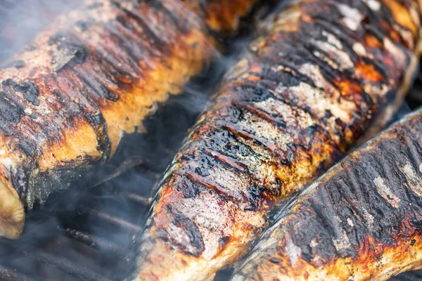 stock image Grilled fish on charcoal grill. Fresh fish barbecue