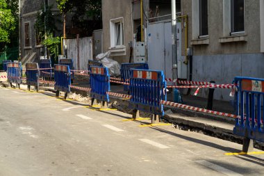 Construction workers at construction site and heavy duty bulldozer in Bucharest, Romania, 2023