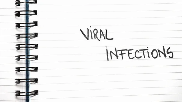 Viral infections handwriting  text on paper, on office agenda. Copy space.