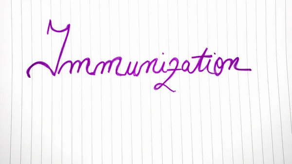 Immunization handwriting  text on paper, on office agenda. Copy space.