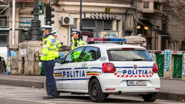 stock image Police agent, Romanian Traffic Police (Politia Rutiera) directing traffic