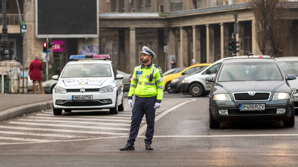 Police agent, Romanian Traffic Police (Politia Rutiera) directing traffic