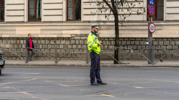 Police agent, Romanian Traffic Police (Politia Rutiera) directing traffic