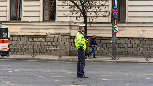Police agent, Romanian Traffic Police (Politia Rutiera) directing traffic