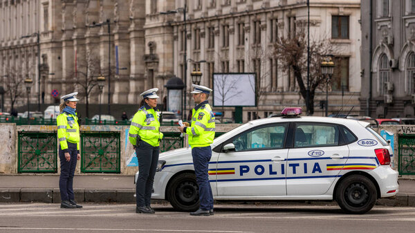 Police agent, Romanian Traffic Police (Politia Rutiera) directing traffic