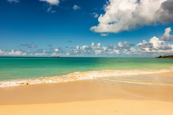 stock image Caribbean beach with white sand, deep blue sky and turquoise water