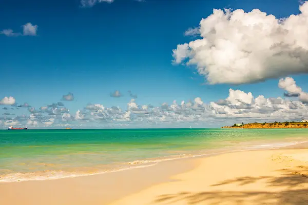 stock image Caribbean beach with white sand, deep blue sky and turquoise water