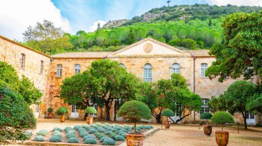 Fontfroide Abbey or Abbaye de Fontfroide is monastery in France gothic walls and arches clipart