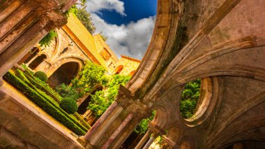 Fontfroide Abbey or Abbaye de Fontfroide is monastery in France gothic walls and arches clipart