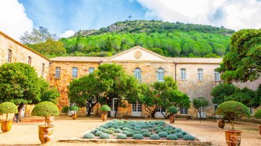 Fontfroide Abbey or Abbaye de Fontfroide is monastery in France gothic walls and arches clipart