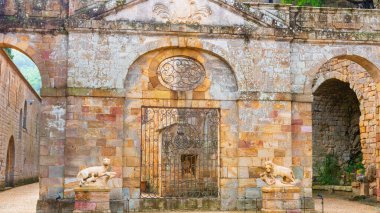 Fontfroide Abbey or Abbaye de Fontfroide is monastery in France gothic walls and arches clipart