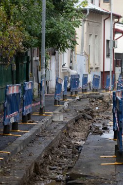 Construction workers at construction site and heavy duty bulldozer in Bucharest, Romania, 2023