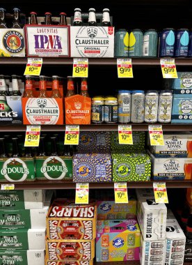 Selection of non-alcoholic beers on the shelf in the liquor department of a Jewel-Osco grocery store in the Chicago area