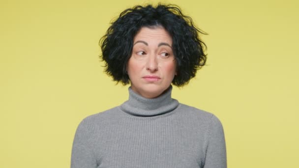 Middle Age Woman Thinking Face Expression Standing Pale Yellow Background — Video Stock