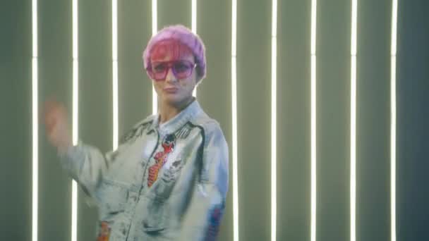 Girl Stylish Fashionable Pink Beanie Sunglasses Denim Jacket Makes Disco — Stockvideo