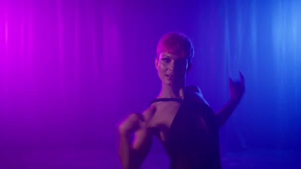 Young Dancer Woman Looking Camera Neon Violet Purple Pink Blue — Stockvideo