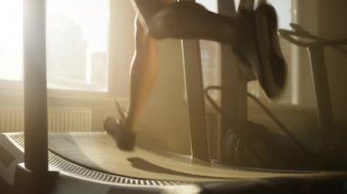 Close-up shot of a woman improving her endurance and strength while working out in gym studio. Unrecognized female athlete during her fitness and cardio routine. High quality 4k footage