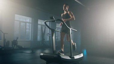 Portrait of caucasian guy in his 30s training and targeting his legs muscles. Close-up shot of dedicated sportsman during intensive cardio workout. High quality 4k footage