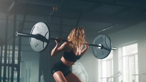 Close View Curly Haired Woman Lifting Heavy Weights Squatting Barbell — Stock video
