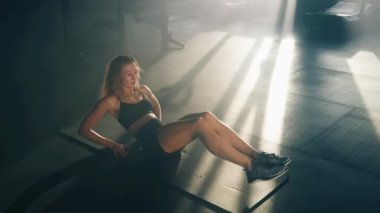 Portrait of female athlete using her body weight and gravity as resistance to build strength and balance. Close-up shot of a woman improving her coordination and flexibility. High quality 4k footage