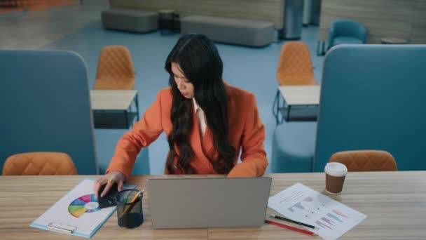 Concentrated Asian Female Making Notes Work Analytics Documents Looks Laptop — Stock Video