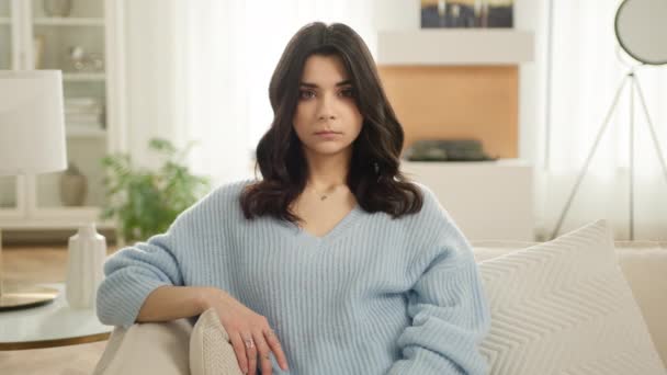 Beautiful Latin American Woman Blue Sweater Looking Camera Sitting Sofa — Stock Video