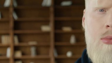 Focused confident handsome smart nordic albino entrepreneur, leader, manager posing. Close up face view business portrait. Serious bearded millennial hipster professional businessman looking at camera