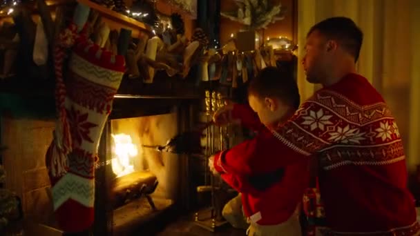 Dad Son Together Cozy Fireplace Hanging Stockings Christmas Garland Lights — Stock Video