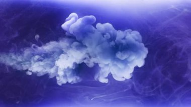 Abstract cloud of white paint mixing with blue water. Colorful ink dissolving underwater in slow motion. Macro shot of drop flowing in blue liquid. Creative backdrop. Animated wallpaper, 4k footage