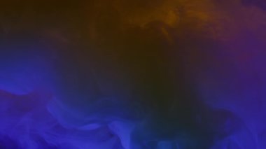 Paint cloud dissolving in yellow and blue colors. Dark acrylic drops mixing in colorful liquid. Mysterious animation underwater. Slow motion effect of paint colors swirling in water, 4k footage