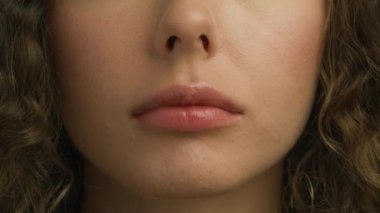 Macro background of pink lips. Expressive emotional fun and joy lifestyle concept. Happy Smiling People Close up Concept. Young female with healthy skin and beautiful cheerful smile. Cosmetics makeup