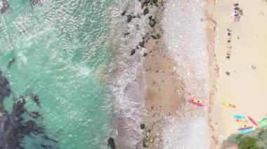 Gün doğumunda manzaralı 4K manzaralı Laguna Sahili 'nin nefes kesici güzelliğini keşfedin. Huzurlu okyanusu, kumlu kıyıları ve büyüleyici bir ortamda sabah aktivitelerini sergileyin.