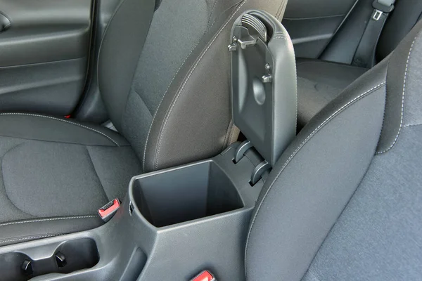Open storage box between front car seats