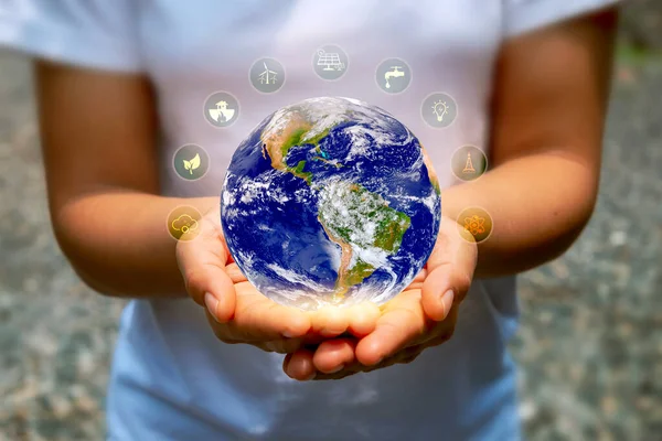 The world is held by human hands-on Earth Day concept (Earth Day) on April 22 of every year to save energy. (Elements of this image furnished by NASA)