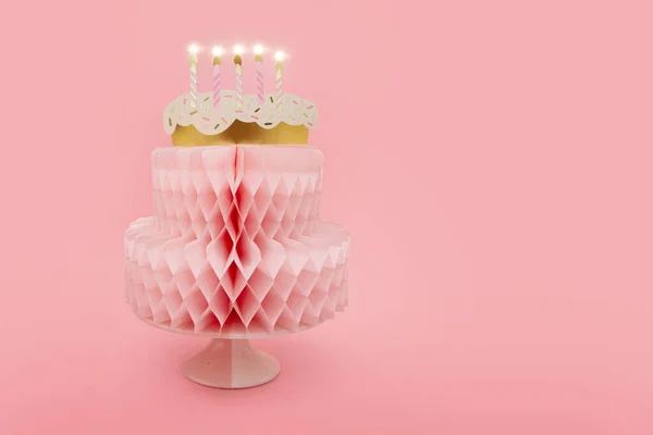Banner birthday cake with candles. Isolated on pink pastel background