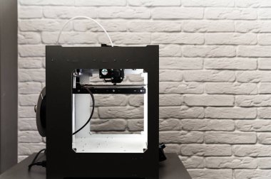 Modern 3D printer homemade in the process. Printing parts on a 3D printer at home. Modern technologies.