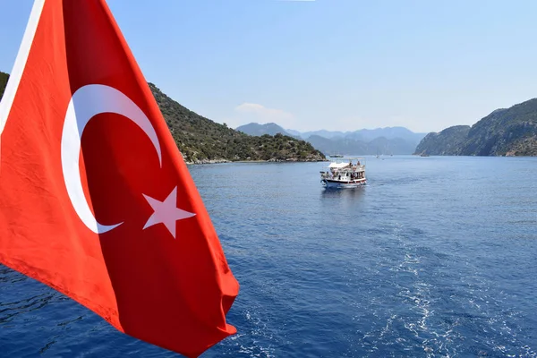 stock image pleasure boat in the sea, mountains and hills. Turkish flag, Trkiye, Marmaris