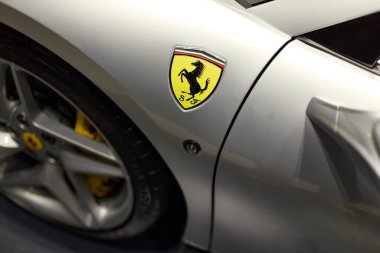 The front wheel of the Ferrari F8 Tributo. Top view of the Ferrari logo. Katowice, Poland- 29.10.2019