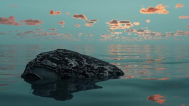 Lonely zen stone on the background of a beautiful sunset in summer. Rest and meditation in India.