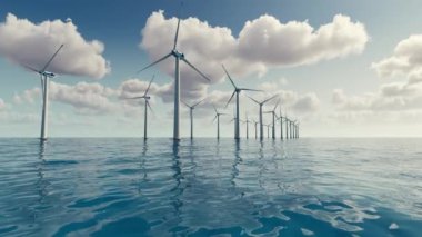 Large wind turbines generating electricity on the sea of a beautiful sunset and clouds.